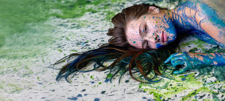 Panorama abstract art portrait of a seductive young brunette redhead woman, dots of blue and green color, decorative, creative expressive abstract body painting art banner, make up, copy space.の写真素材