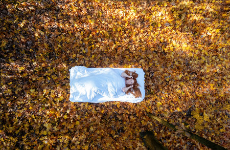 top view from above to beautiful sexy lovely red-haired cute mature woman, with yellow, orange maple...