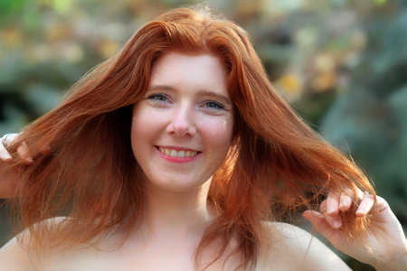 Portrait of a young lovely foxy girl with free shoulders, beautiful sexy attractive fiery woman,...
