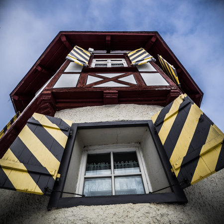 Tower building with shutters