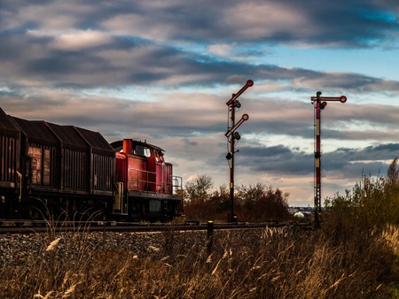 freight train getting signal to startの写真素材
