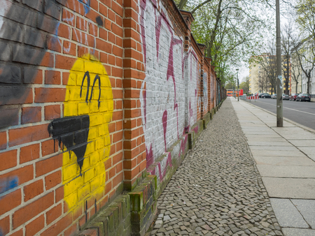 graffiti on a brick wall in berlinのeditorial素材