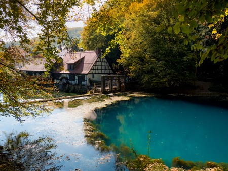 The well "Blautopf" in Blaubeuren, Germany in autumnの写真素材