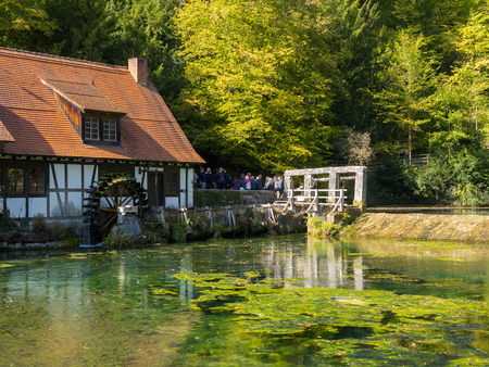 Historic mill at the well "Blautopf" in Blaubeuren, Germanyの写真素材