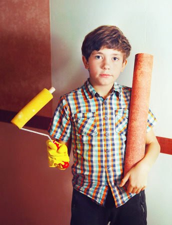 preteen handsome boy with roll coaster and wallpaperの写真素材