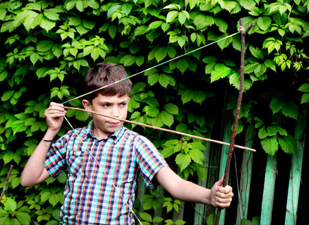 boy with   turnpike aiming to the target