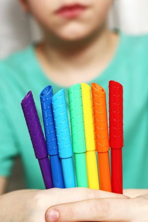 felt pen raw in  boy hand close up photoの写真素材