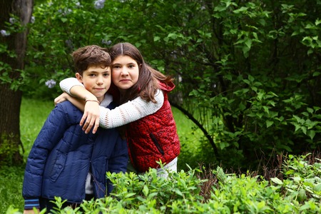 teenage brother sister walk on the streetの写真素材