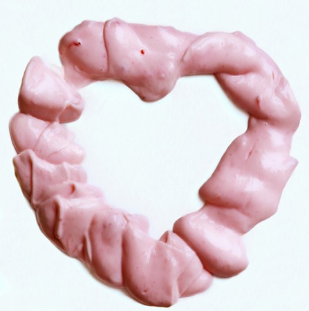 fruit pink yogurt heart close up photo on white backgroundの写真素材