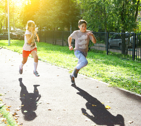 Russia, Moscow - September 13, 2016: Unidentified school kids on outdoor sport sprint race running competition in school yard, in Moscow, September 13, 2016のeditorial素材