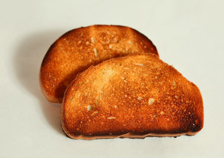 toast, bread slice burned overexposed in the toster