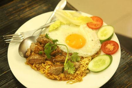 vietnamese noodle with fried eggs and salad