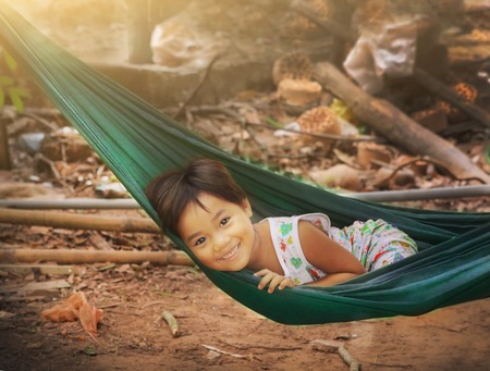 Ho Chi Minh, Vietnam, Januar 15, 2017: Unidentified vietnamese little girl in hammock close up photo in in Ho Chi Mihn city, Vietnam, Januar 15, 2017.のeditorial素材