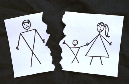 dad and mom with son divorce drawing on torn paperの写真素材