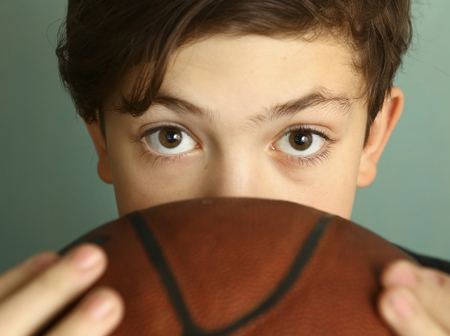 teeb boy with basketball ball and sleeveless t-shirtの写真素材