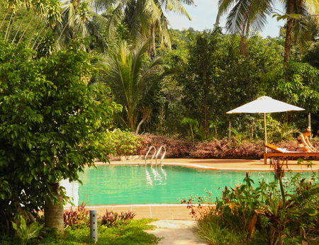 open air swimming pool in tropical vietnamese jungle