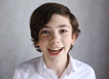 preteen boy laughing smiling portrait close up photo