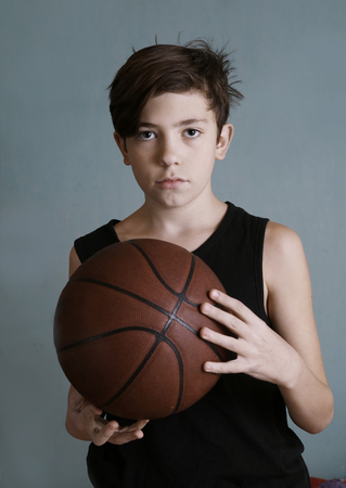 teenager boy with basketball ballの写真素材