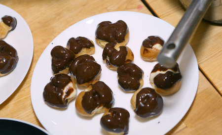 profiterols cooking lesson close up photo on kitchen interior