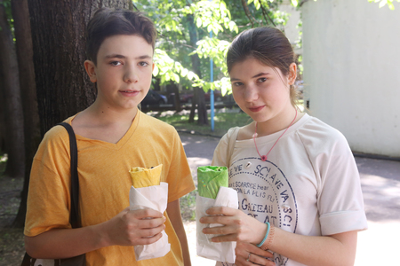 Moscow, Russia, May 27: Unidentified kids girl and boy on vegan food market with falafel lavash wrap close up photo close up photo on May 27, Moscow, Russia.のeditorial素材