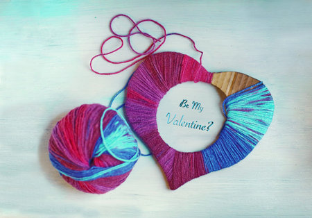 happy Valentines day still life card with woolen yarn thread heart , ball of thread and copy space...