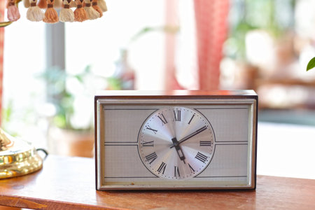 retro vintage clock on tablie decoration in cafe interior close up photo