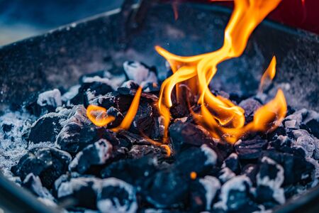 A close up of a fire from a barbecue or fire pitの写真素材