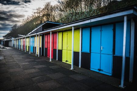 Colorful seaside beach huts at the coast in Filey, Englandの写真素材