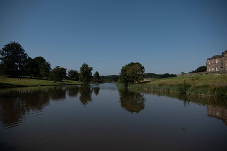 A lake with a beautiful reflection of the countrysideの写真素材