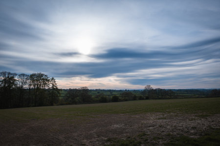 A open farmers field showing the beautiful colors in the sky