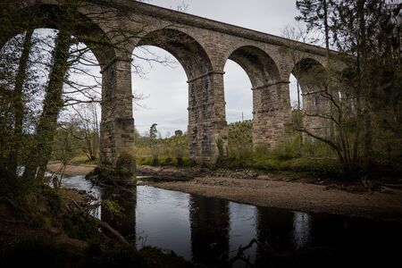 An old stone built British viaduct in the Yorkshire countrysideの写真素材
