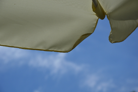 Blue Sky with Parasol (Sunshade)の写真素材
