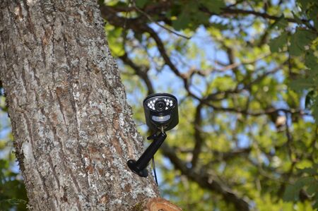 Closeup on a video surveillance cameraの写真素材