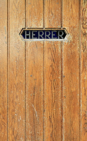Texture of old wooden door. A men's toilet with the word "GENTLEMEN" in Danishの写真素材
