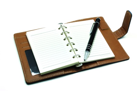 Notebook and pen isolated on white backgroundの写真素材