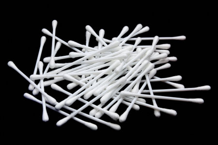 Cotton sticks isolated on black background
