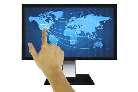 Hand pressing world wide mail  on the LED monitorの写真素材