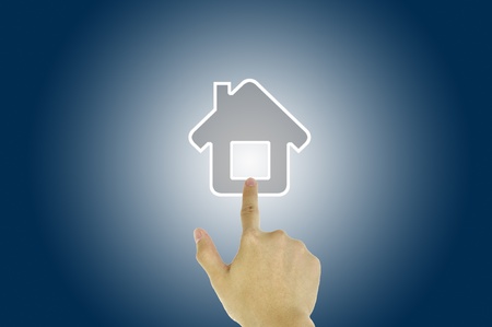Hand pressing home symbolの写真素材