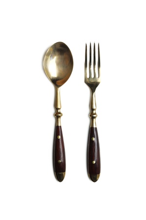 brass spoon and fork isolated on a white backgroundの写真素材