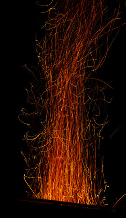 Fire sparks on black background.