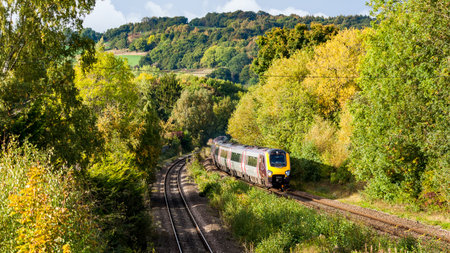 A Bombardier Voyager Cross Country Train approaching Duffield in Derbyshire with the picturesque ...