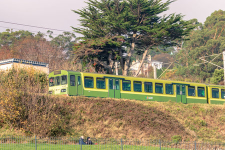 Killiney, Dun Laoghaire, Ireland, November 14, 2021.  A DART train leaves Killiney Station heading...