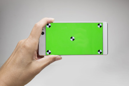 Smart phone with green screenの写真素材