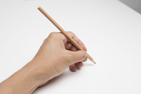 Hand holding pencilの写真素材