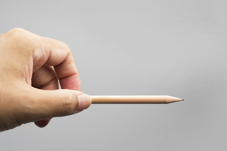 Hand holding pencilの写真素材