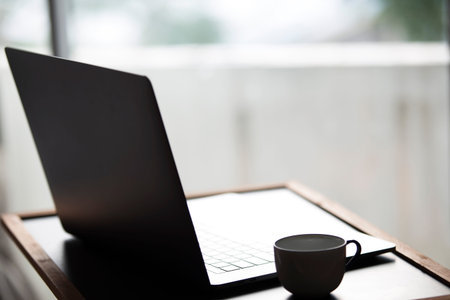 Laptop with hot coffee