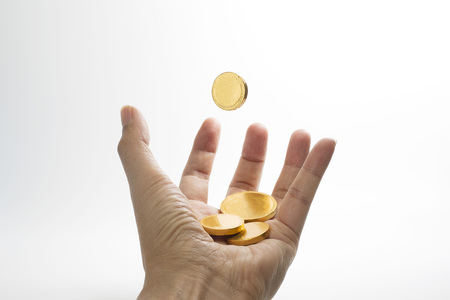 Gold coin drop to hand first person viewの写真素材