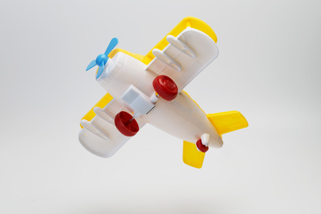 Toy airplane on white backgroundの写真素材