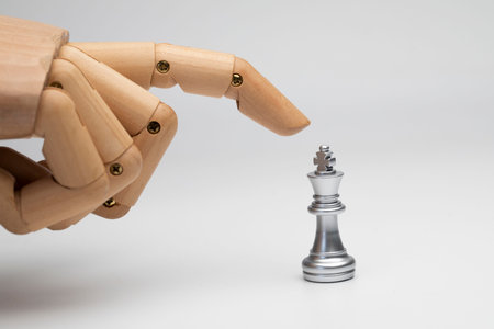 robot finger reaching out touch the chess