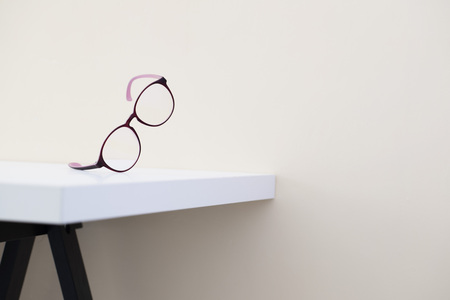 eyeglasses on white table Modern office's work environment conceptの写真素材